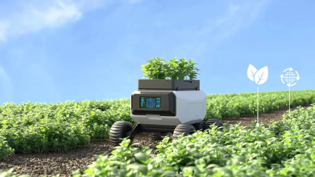 A futuristic agricultural robot equipped with wheels, transporting young plants through a crop field under a clear blue sky. The robot displays digital icons on its front panel, indicating its operational status.