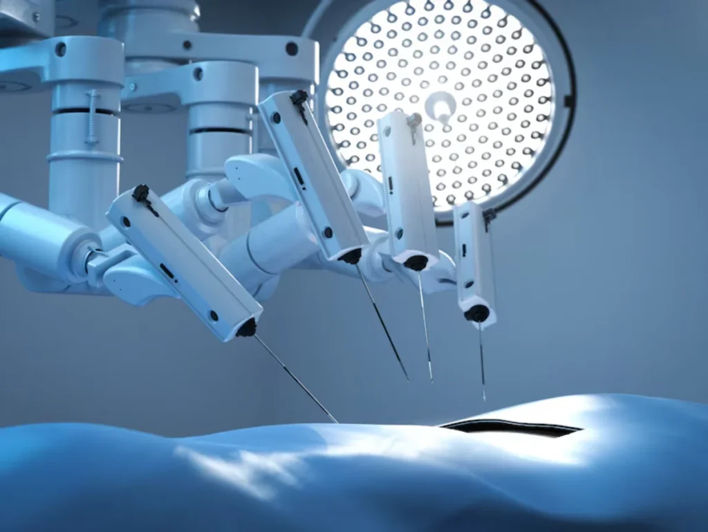 A medical robotic system featuring multiple articulated arms equipped with surgical instruments, operating in a sterile blue-lit surgical environment under a large overhead surgical light.